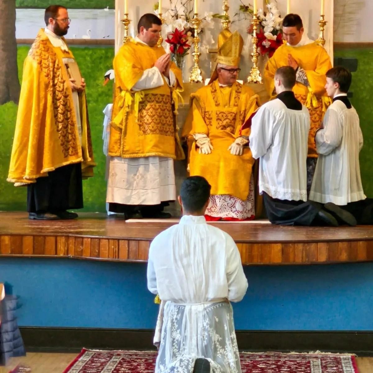 A liturgical group photograph labeled Fr. Hoopes with Bishop Morgan.